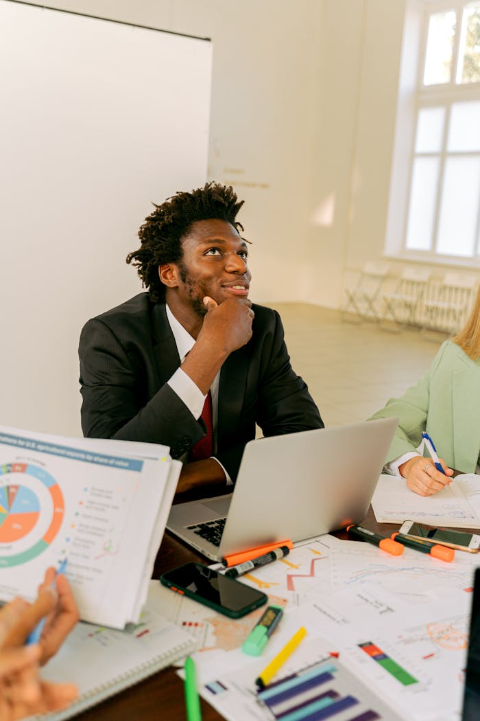 gallery-2 Business professional brainstorming in a modern office setting.